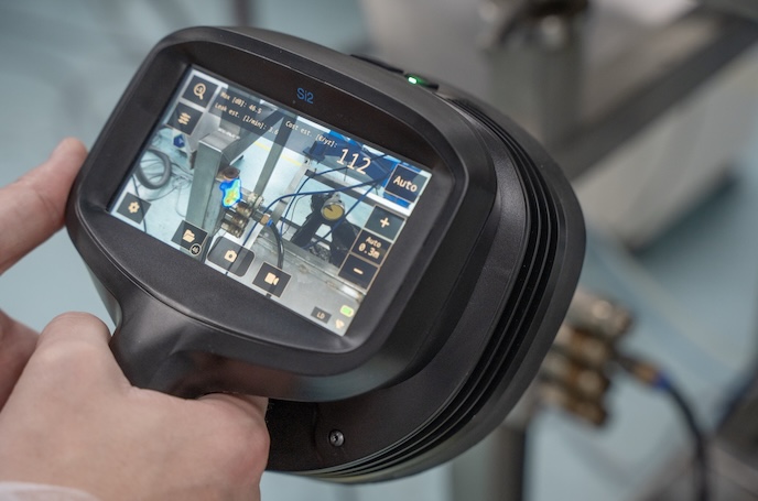 handheld camera depicting image of leak